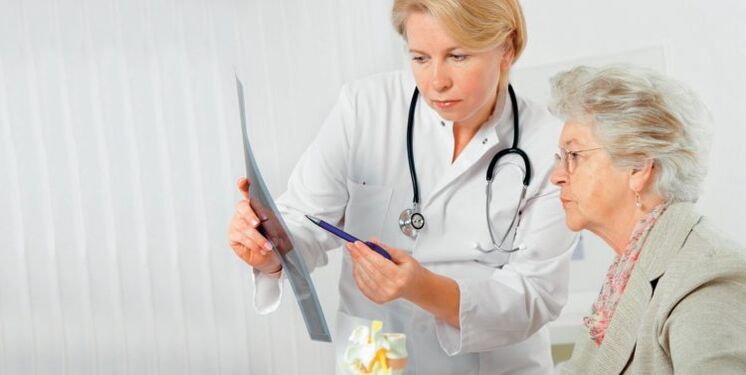 a doctor prescribes treatment for lower back pain